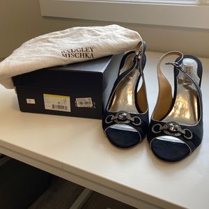 Cute satin pump with rhinestone detail.